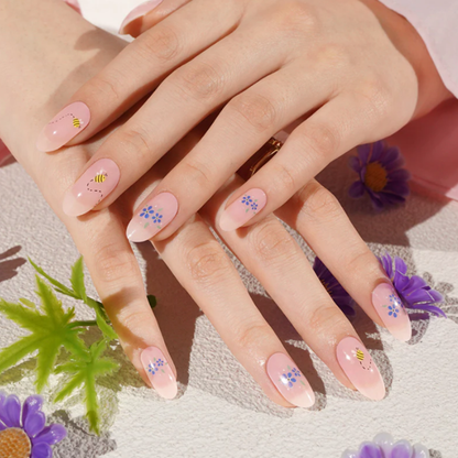 ASTRID nude floral UV gel nail strips with blue and yellow flowers